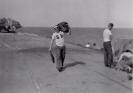 Ray O'Grady removing Parachute and liferaft from the Aircraft.